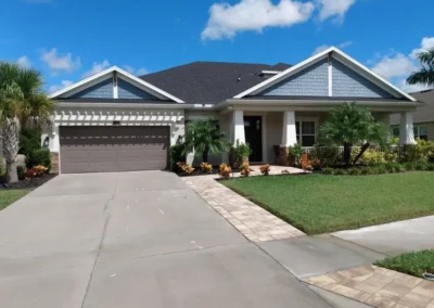 Fresh, clean driveway leading to a large home